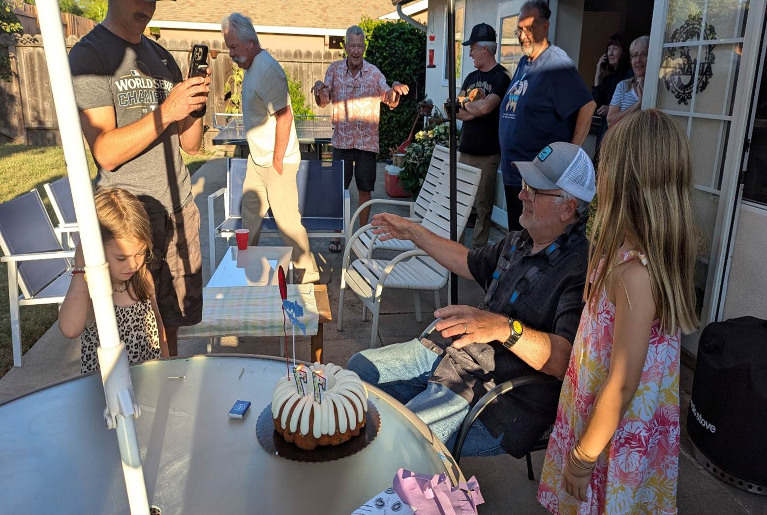 A group of people around a cake

AI-generated content may be incorrect.