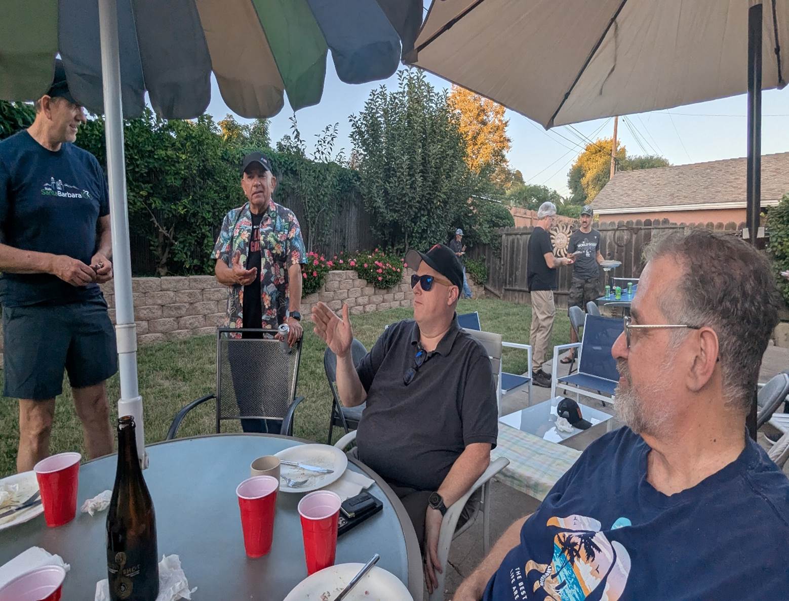 A group of men sitting at a table

AI-generated content may be incorrect.