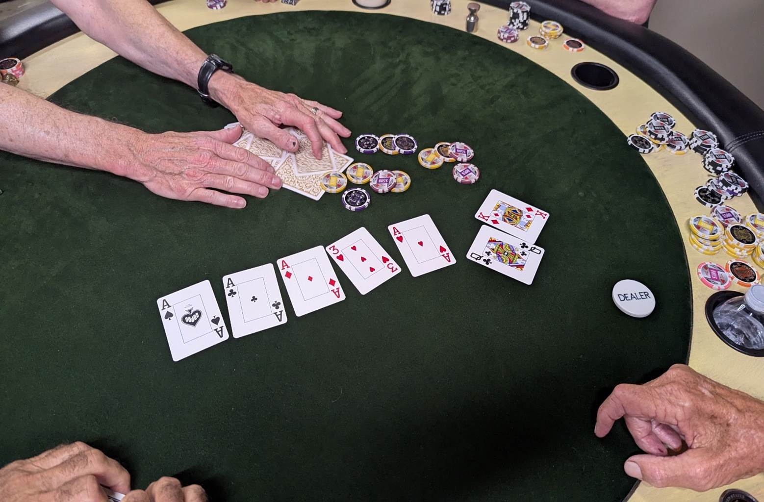 A person playing poker with cards

AI-generated content may be incorrect.