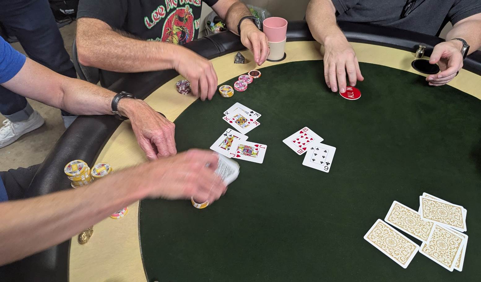 A group of people playing poker

AI-generated content may be incorrect.
