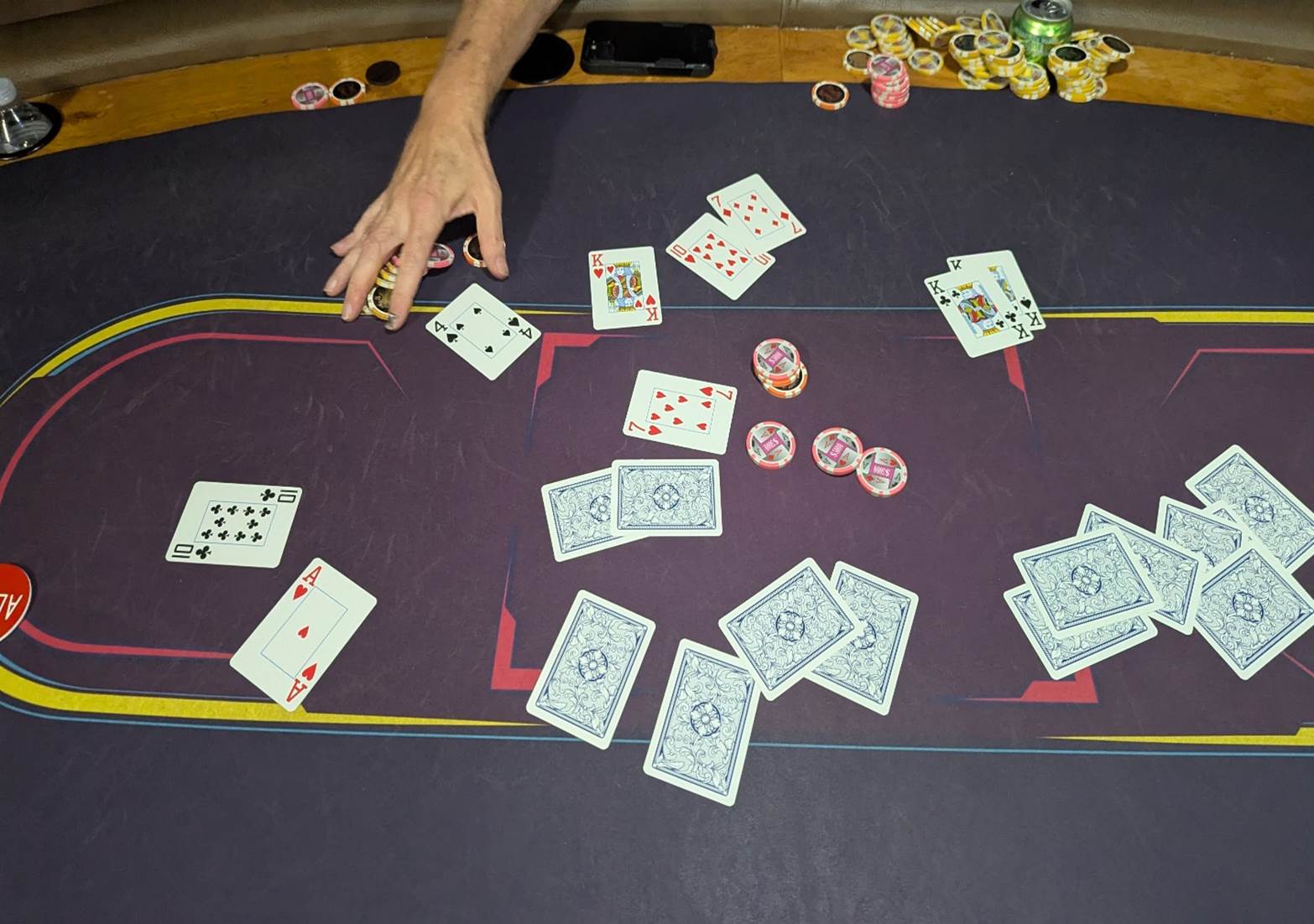 A person playing cards on a table

AI-generated content may be incorrect.