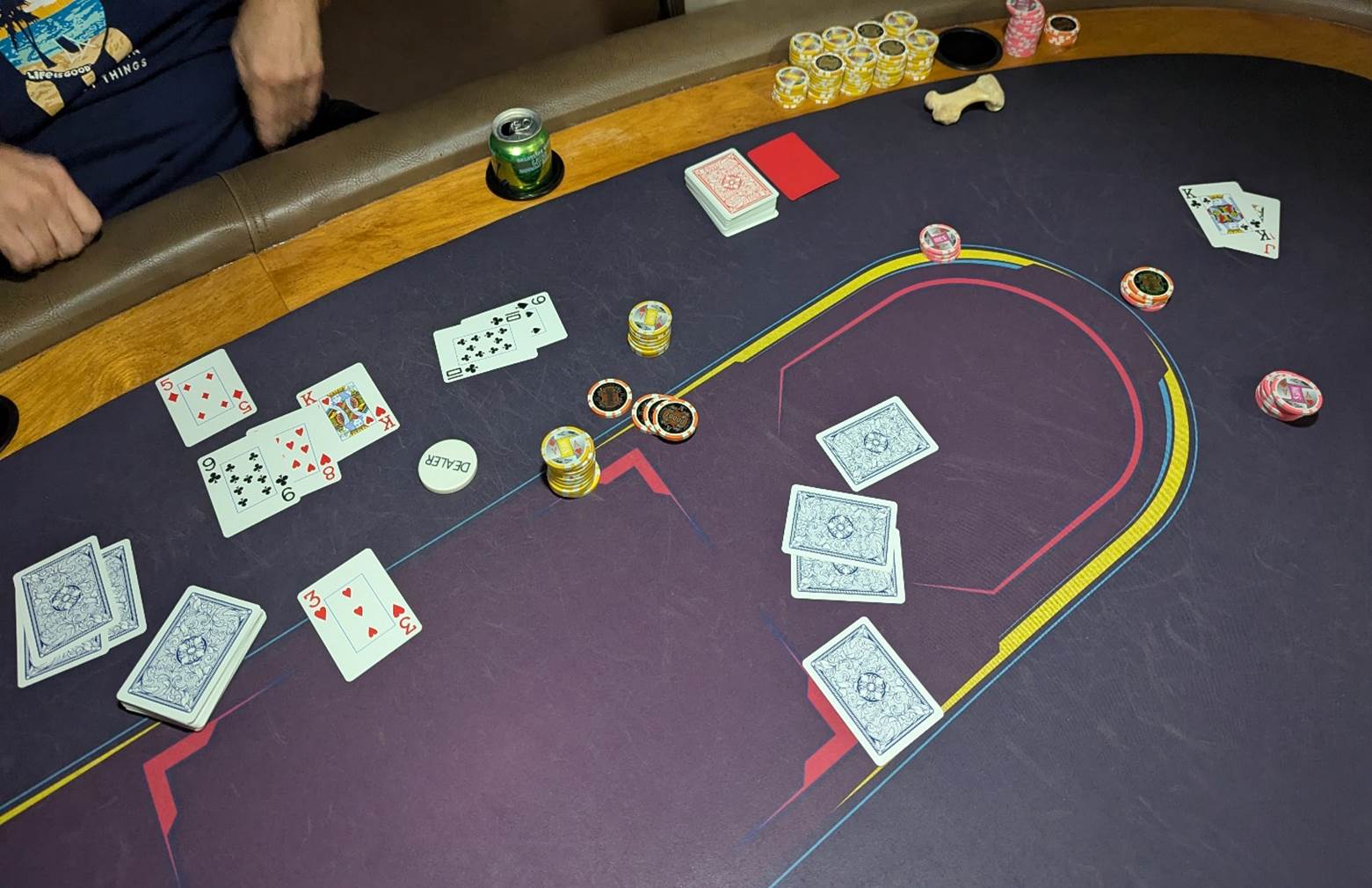 A poker table with cards and chips

AI-generated content may be incorrect.