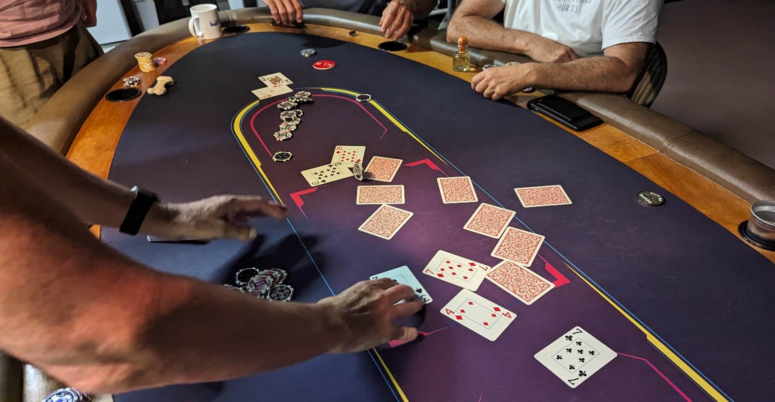 A group of people playing poker

Description automatically generated