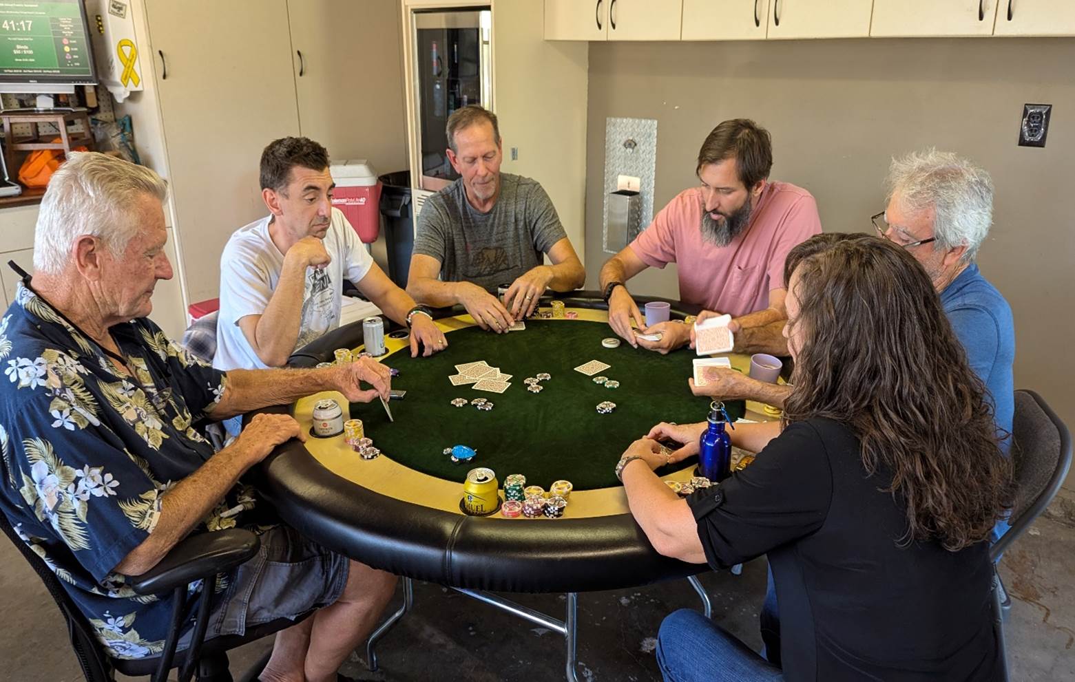 A group of people sitting around a round table

Description automatically generated