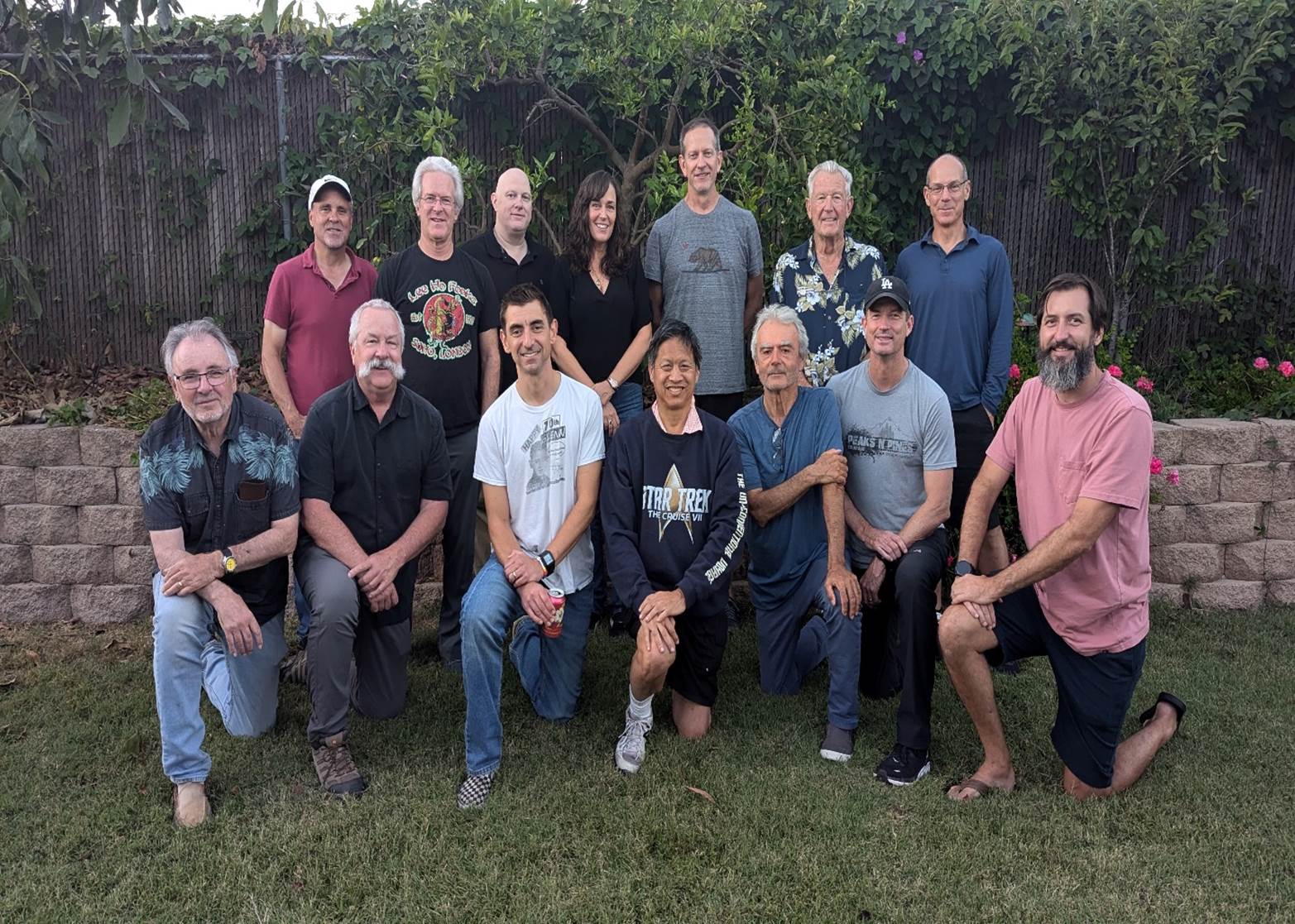 A group of people posing for a photo

Description automatically generated