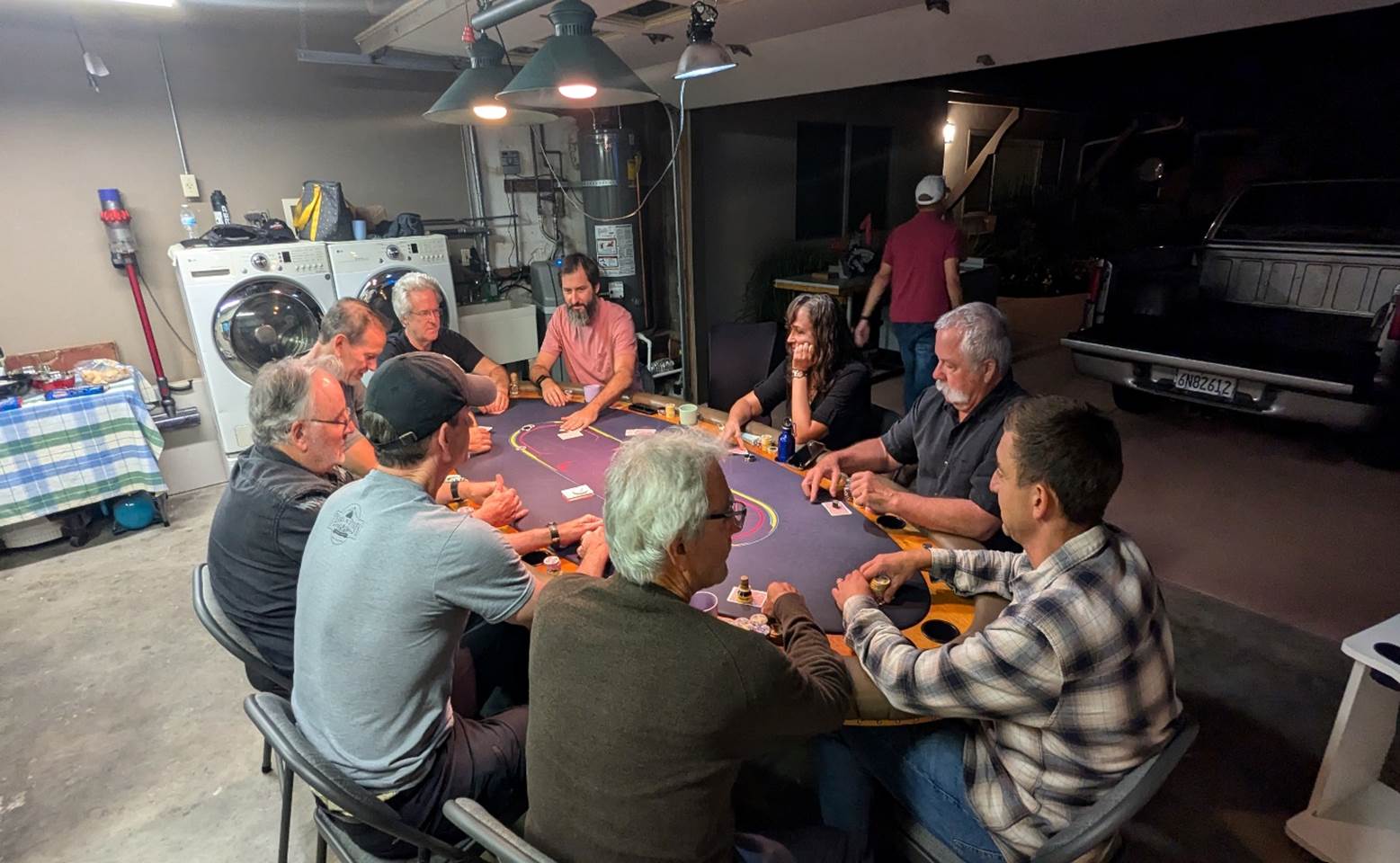 A group of people around a table

Description automatically generated