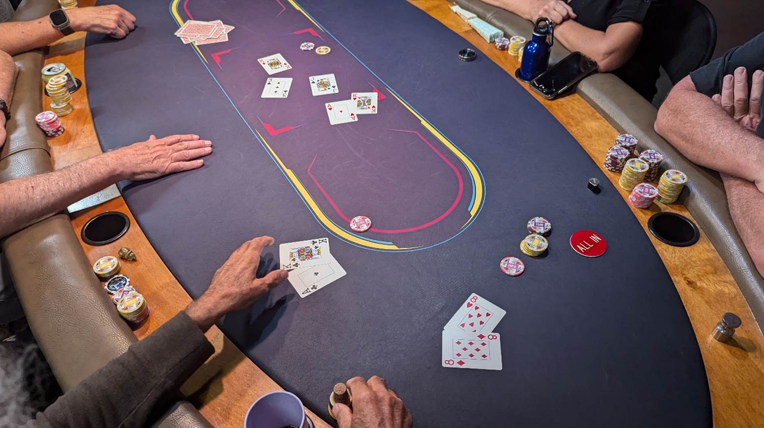 A group of people playing poker

Description automatically generated