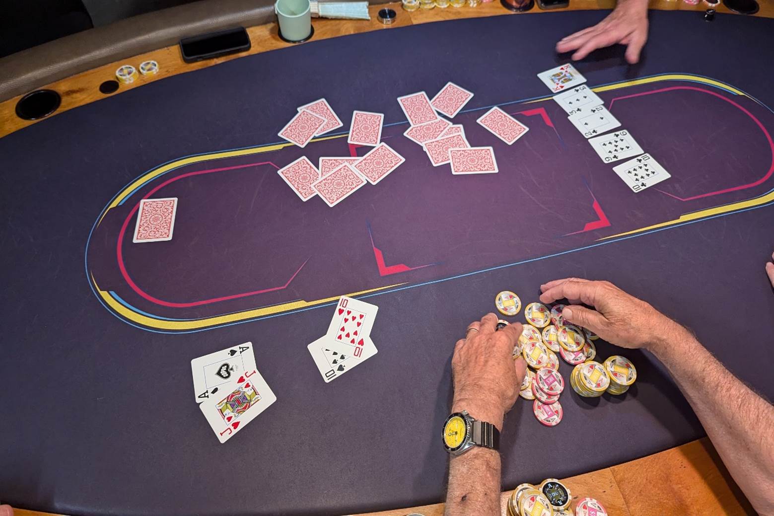 A group of people playing poker

Description automatically generated