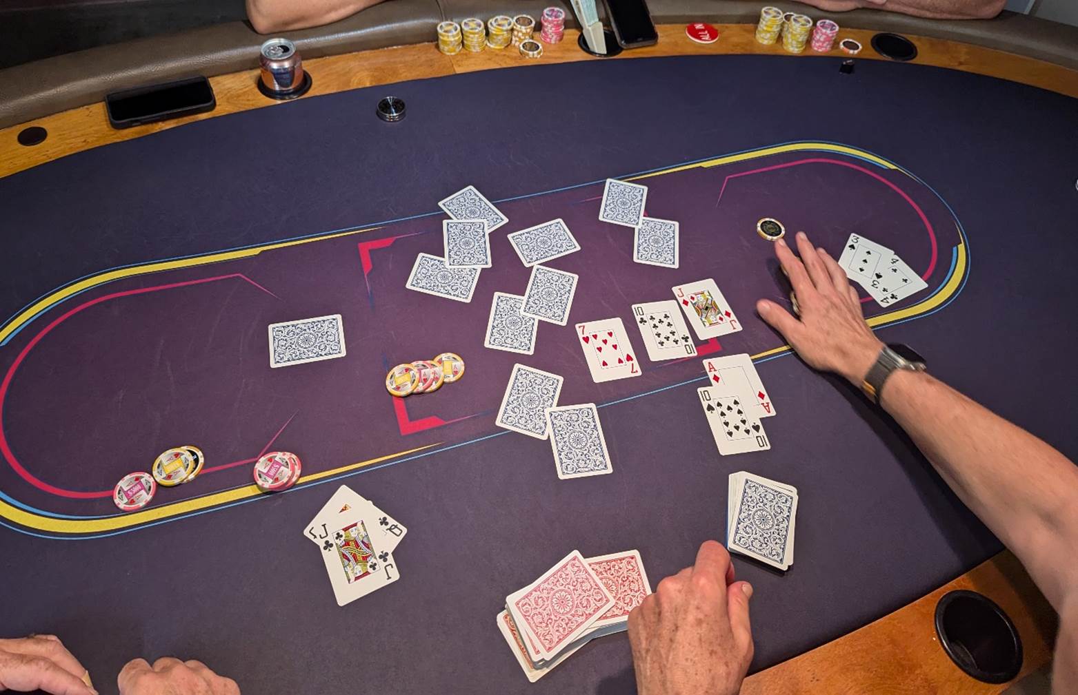 A person playing poker on a table

Description automatically generated